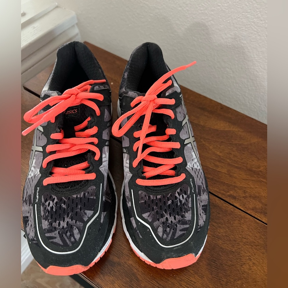 ASICS women’s 6.5 black with orange trim. Athletic shoe - barely worn.